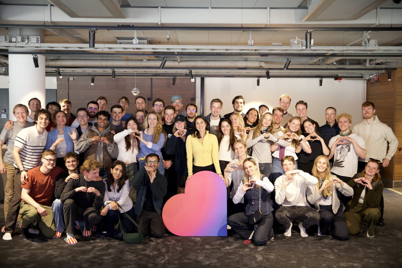 A CDTM class on an ecosystem trip, gathered around a pink heart